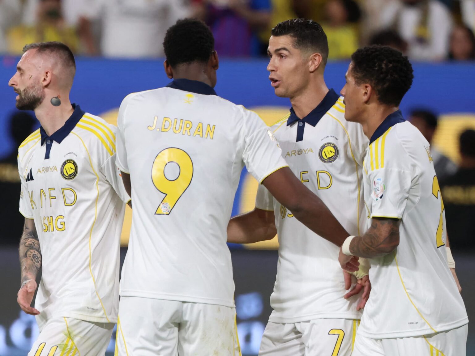Al-Nassr's Portuguese forward Cristiano Ronaldo (#7) celebrates with his teammates after scoring his team's second goal from the penalty spot during the Saudi Pro League football match between Al-Nassr and Al-Khaleej at the Al-Awwal Park stadium in Riyadh. (Photo by Fayez NURELDINE/AFP via Getty Images)